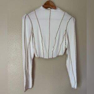12th Tribe White Cropped Long Sleeve Bodysuit with Contrast Seams